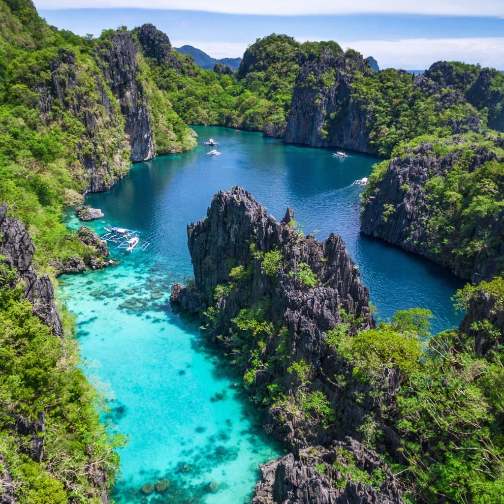 Azure seas and jagged limestone cliffs of El Nido Island, Philippines