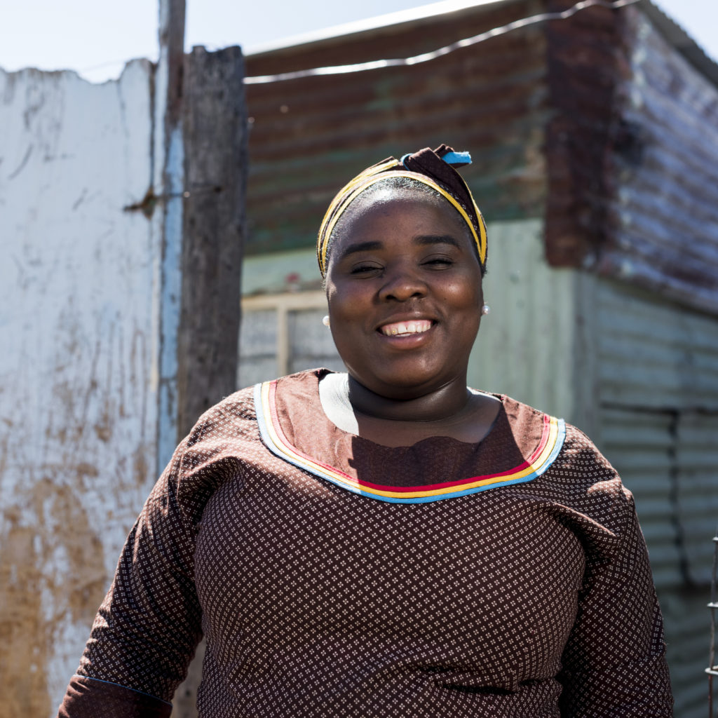 Meet friendly South African locals like this lady when you take a tailor-made trip with Alfred&.